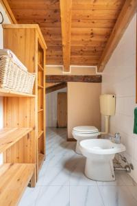 a bathroom with a toilet and a sink at Lo chalet di Giulia - Romantic terrace in Bologna
