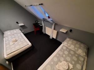 Postel nebo postele na pokoji v ubytování Hotel Boršičanka