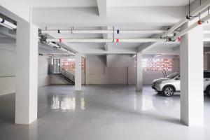 an empty parking garage with a car parked in it at RedDoorz Plus near UMS Solo 2 in Solo
