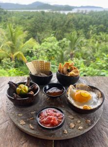 a tray of food on top of a table at Jungle bar Resto & Cottages in Port Barton