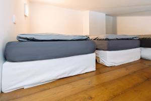 three mattresses stacked on top of each other in a room at Horský apartmán Temari 7 Klínovec in Loučná pod Klínovcem