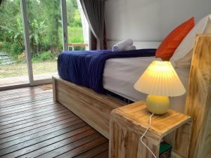 Postel nebo postele na pokoji v ubytování Volcano rim Kintamani