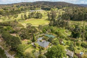 an aerial view of a park with a house and trees at Centennial Cottage 2 - Botanica in Bowral