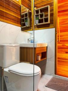 a bathroom with a toilet and a sink at Mumsa Beach Resort & Restaurant in Ban Huai Yang