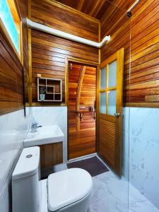 a bathroom with a toilet and a sink at Mumsa Beach Resort & Restaurant in Ban Huai Yang