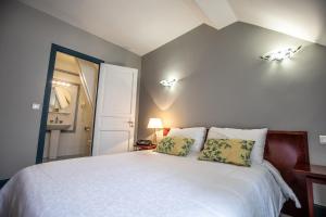 Letto o letti in una camera di Hôtel Terminus