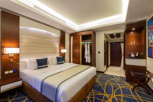 Postel nebo postele na pokoji v ubytování Blue Diamond Hotel Jeddah