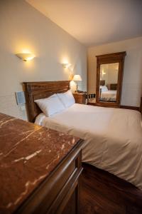 Letto o letti in una camera di Hôtel Terminus