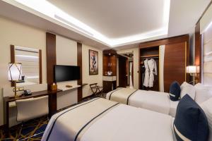 Postel nebo postele na pokoji v ubytování Blue Diamond Hotel Jeddah