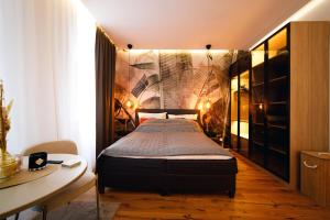 Llit o llits en una habitació de Lariana Apartment