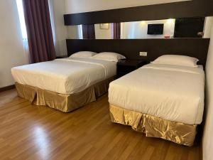 Postel nebo postele na pokoji v ubytování Uptown Chinatown