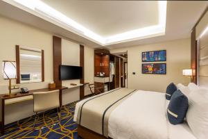 Postel nebo postele na pokoji v ubytování Blue Diamond Hotel Jeddah
