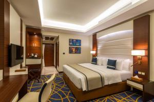 Postel nebo postele na pokoji v ubytování Blue Diamond Hotel Jeddah