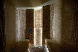 a bathroom with two chairs and a window at Vila Pavlina in Kranjska Gora