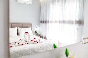 Postel nebo postele na pokoji v ubytování Sebastian Luxury Apartments