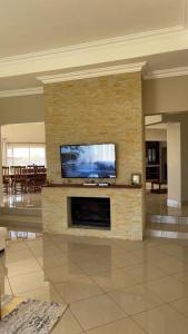A television and/or entertainment centre at Commodious and Contemporary double home - 2042