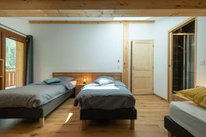 Posteľ alebo postele v izbe v ubytovaní Les 3 Sophies - Magnifique chalet pour 1 à 8 personnes proche des remontées mécaniques des prodains