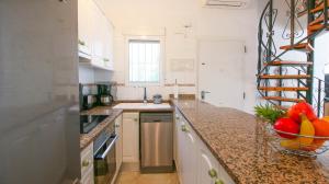 Kuchyň nebo kuchyňský kout v ubytování Residencial El Cortijo