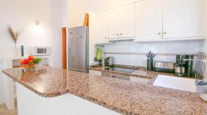 Kuchyň nebo kuchyňský kout v ubytování Residencial El Cortijo