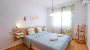 Postel nebo postele na pokoji v ubytování Residencial El Cortijo