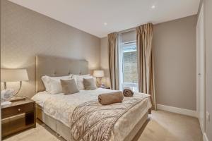 Легло или легла в стая в Modern 2 bedroom & 2 bathroom apartment in Fulham