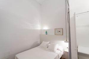 Posteľ alebo postele v izbe v ubytovaní Hostal Argo