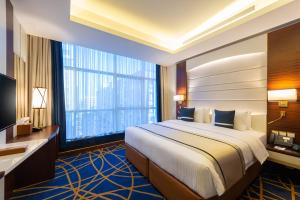 Postel nebo postele na pokoji v ubytování Blue Diamond Hotel Jeddah
