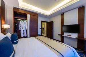 Postel nebo postele na pokoji v ubytování Blue Diamond Hotel Jeddah