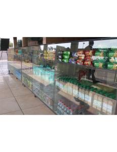 a grocery store aisle with a display of food at Hotel Narmada, Kevadia, Narmada in Lāchharas