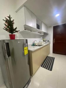 Kuchyň nebo kuchyňský kout v ubytování 88Minesview LODGE By SUNTRUST CONDOMINIUM
