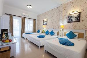 Postel nebo postele na pokoji v ubytování Hanoi Jade Hostel