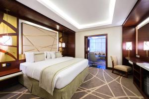 Postel nebo postele na pokoji v ubytování Blue Diamond Hotel Jeddah