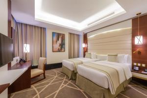 Postel nebo postele na pokoji v ubytování Blue Diamond Hotel Jeddah