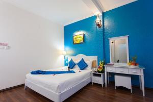 Letto o letti in una camera di Hanoi Jade Hostel