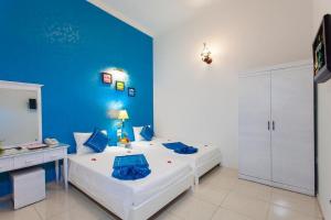 Letto o letti in una camera di Hanoi Jade Hostel