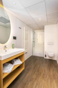Koupelna v ubytování Aparthotel Adagio Access Nancy Centre