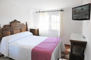 Ένα ή περισσότερα κρεβάτια σε δωμάτιο στο Hostal Puerto Lepe