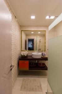 a bathroom with a sink and a mirror at Casa Lavenda in Plovdiv