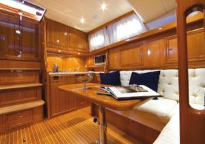 a kitchen with a table in a boat at Casa Ilva in La Maddalena