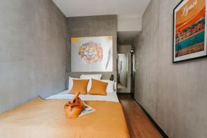 Postel nebo postele na pokoji v ubytování Hôtel Taggât