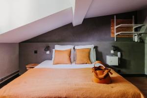 Postel nebo postele na pokoji v ubytování Hôtel Taggât