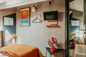 Postel nebo postele na pokoji v ubytování Hôtel Taggât