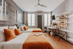 Postel nebo postele na pokoji v ubytování Hôtel Taggât