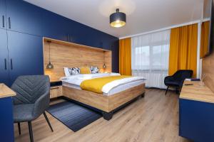 Ένα ή περισσότερα κρεβάτια σε δωμάτιο στο Ioana Residence Bucovina