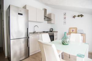 Kuchyňa alebo kuchynka v ubytovaní Apartments Up&Up