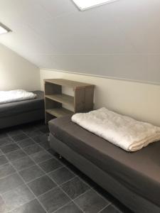 Ένα ή περισσότερα κρεβάτια σε δωμάτιο στο Appartement De Graanzolder aan Zeeuwse kust