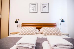 Posteľ alebo postele v izbe v ubytovaní Apartments Up&Up