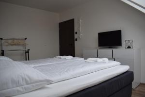 Postel nebo postele na pokoji v ubytování Apartmány Pod Novou