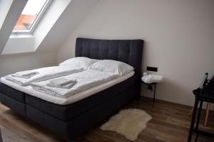 Postel nebo postele na pokoji v ubytování Apartmány Pod Novou