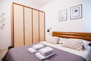 Posteľ alebo postele v izbe v ubytovaní Apartments Up&Up
